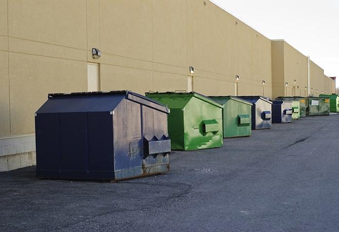 a collection of bright and vibrant dumpsters in a construction zone in Manassas